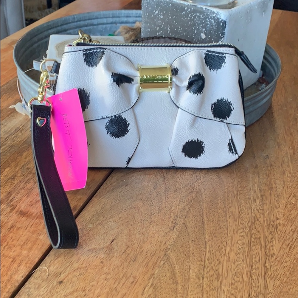Betsy Johnson wristlet in cream with black detail